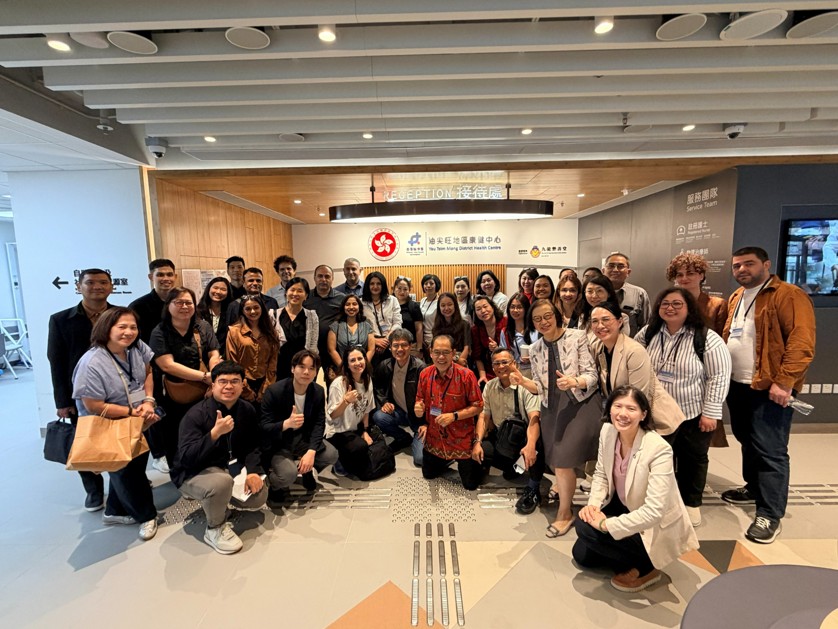 Group photograph in the lobby of an integrated health service centre, WHO Collaborating Centre, HKU